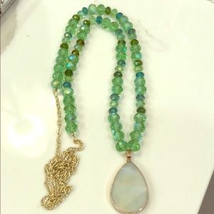 New green beaded necklace with stone accent